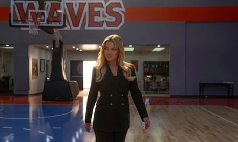 Kate Hudson walking through an indoor sports arena in Running Point