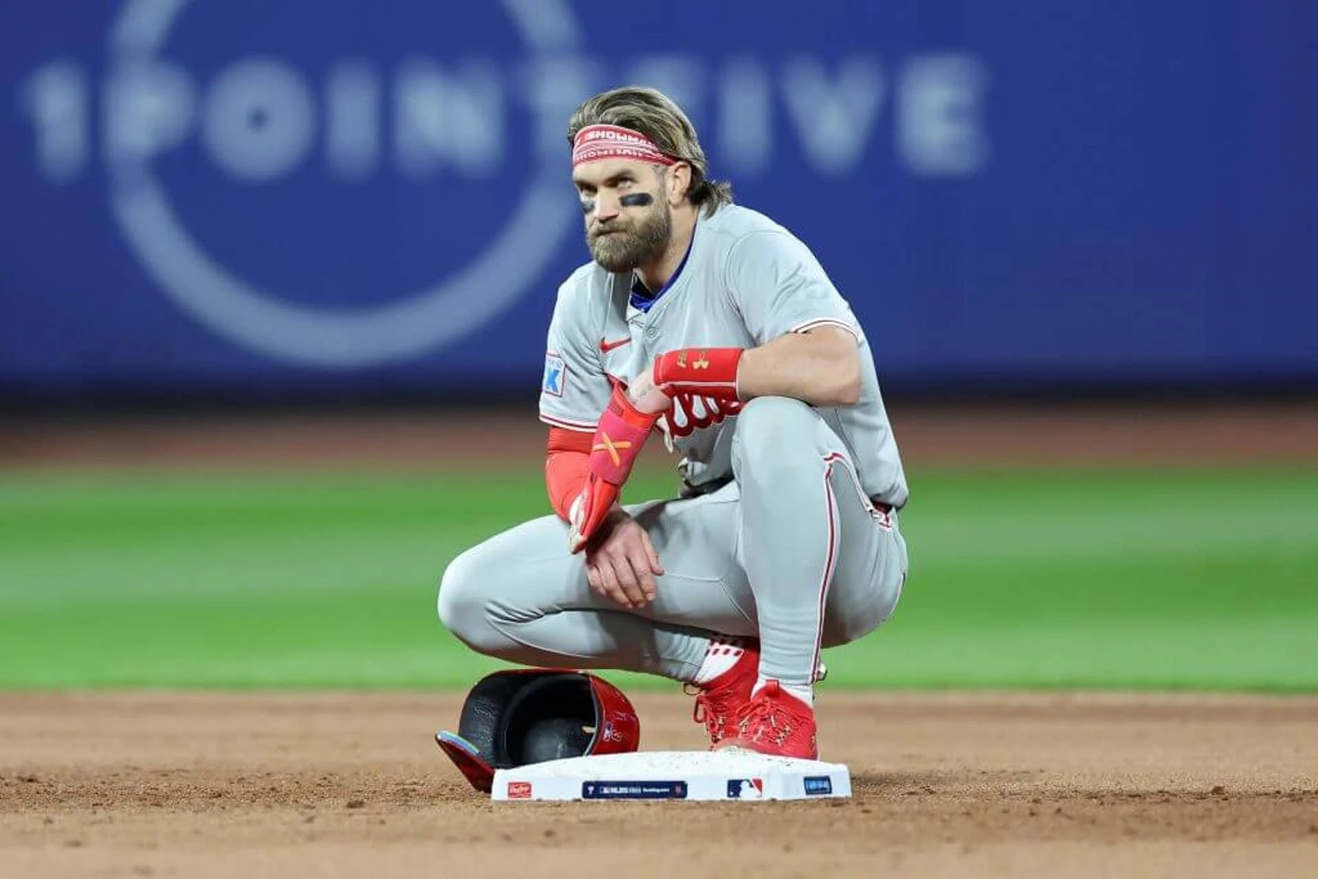 NEW YORK, NEW YORK - OCTOBER 09: Bryce Harper #3 of the Philadelphia Phillies looks on from second base in the sixth inning against the New York Mets during Game Four of the Division Series at Citi Field on October 09, 2024 in New York City. (Photo by Luke Hales/Getty Images)