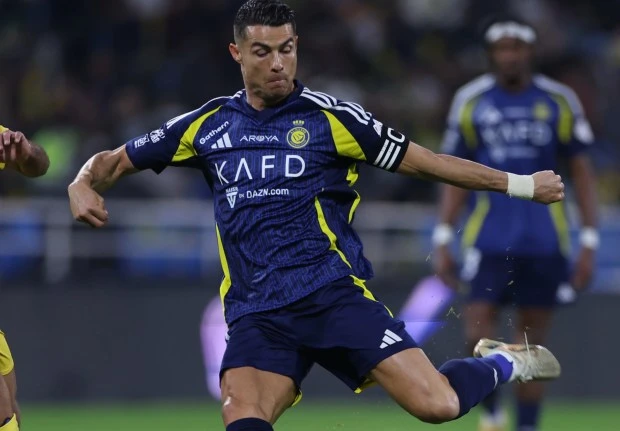 BURAYDAH, SAUDI ARABIA - JANUARY 16: Cristiano Ronaldo of Al-Nassr kicks the ball during Al-Taawoun vs Al-Nassr SPL match on January 16, 2025 in Buraydah, Saudi Arabia.