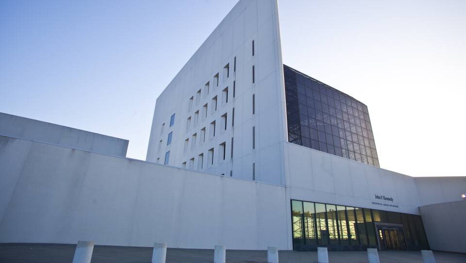 A large concrete and glass building.