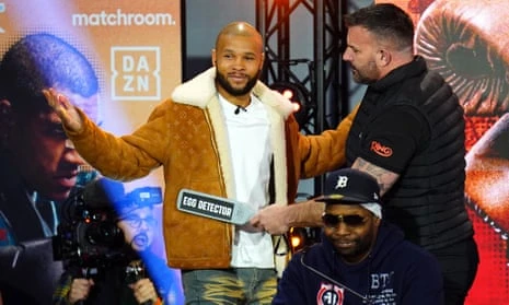 Chris Eubank Jr is screened by a security guard before Thursday’s press conference.