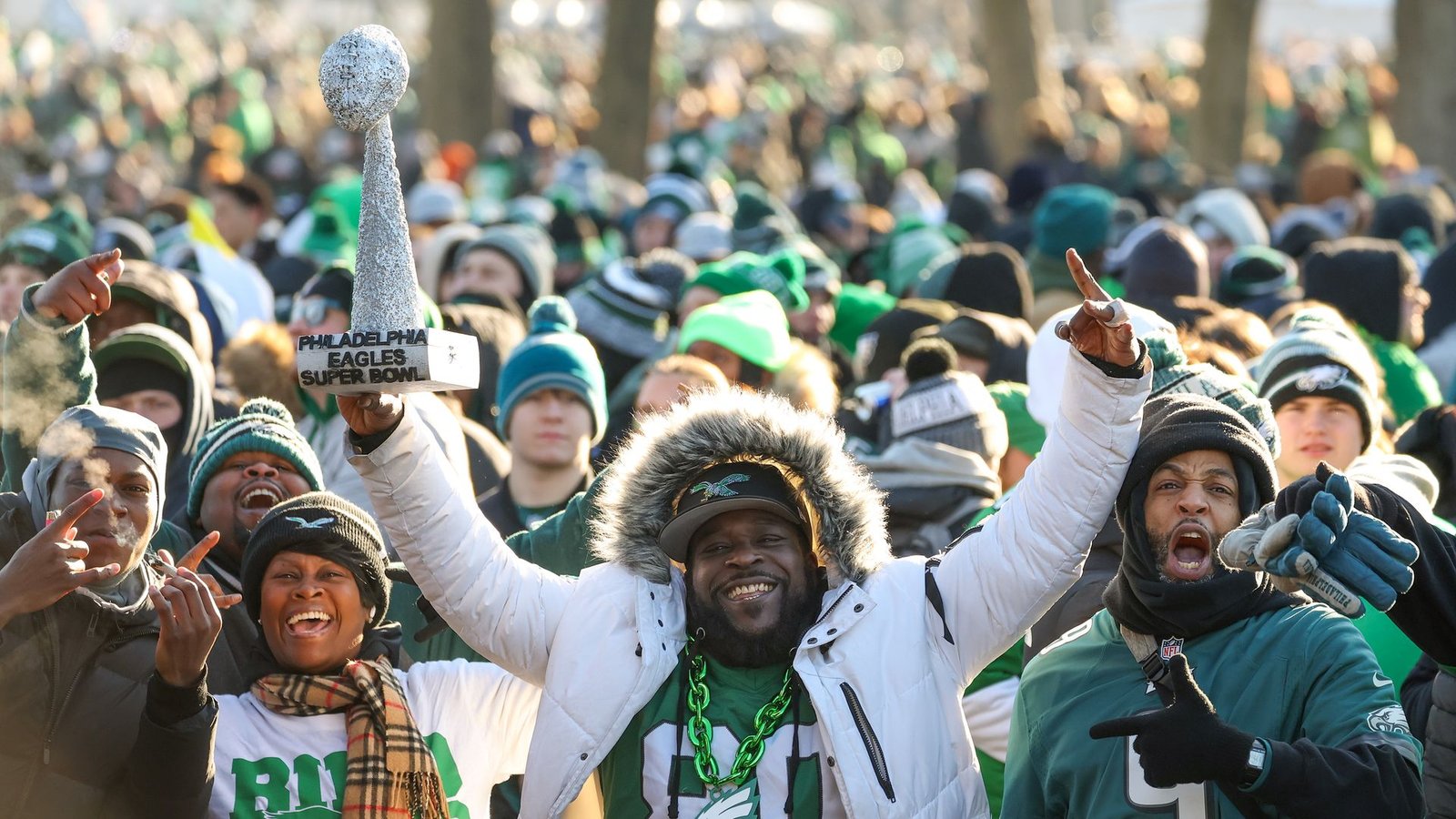 Fans cheer while waiting for the Eagles Super Bowl parade to begin,