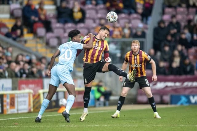 EXPERIENCE: Bradford City midfielder Antoni Sarcevic (centre) has won seven promotions (Image: Tony Johnson)