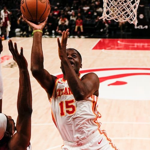 Atlanta Hawks center Clint Capela (15) shoots against Miami Heat center Bam Adebayo (13) during the first half of an NBA basketball game, Monday, Feb. 24, 2025, in Atlanta. (AP Photo/Mike Stewart)