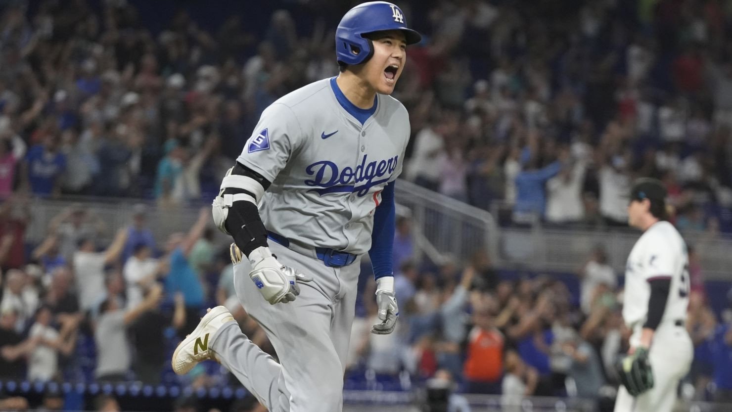 Los Angeles Dodgers' Shohei Ohtani reacts after hitting his 50th home run of the season during the seventh inning of a baseball game against the Miami Marlins on September 19, 2024.