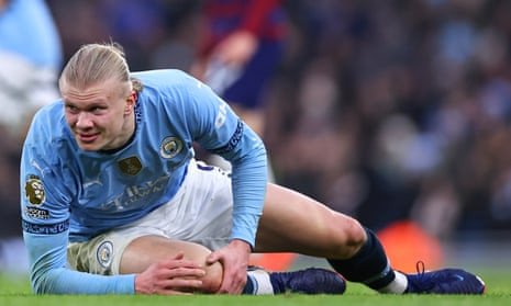 Manchester City’s Erling Haaland reacts after an injury during the Premier League match against Newcastle.