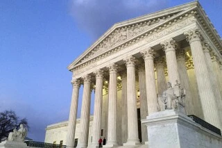 The Supreme Court at sunset in Washington, Feb. 13, 2016. (AP Photo/Jon Elswick, File)