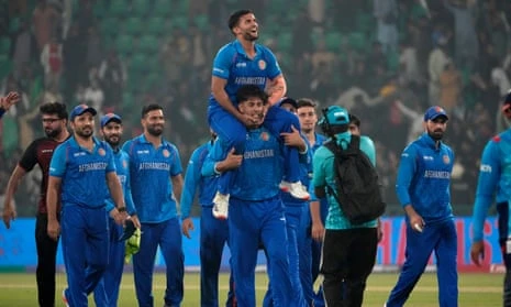 Azmatullah Omarzai is hoisted aloft by his teammates after Afghanistan pull off a famous victory over England in Lahore.